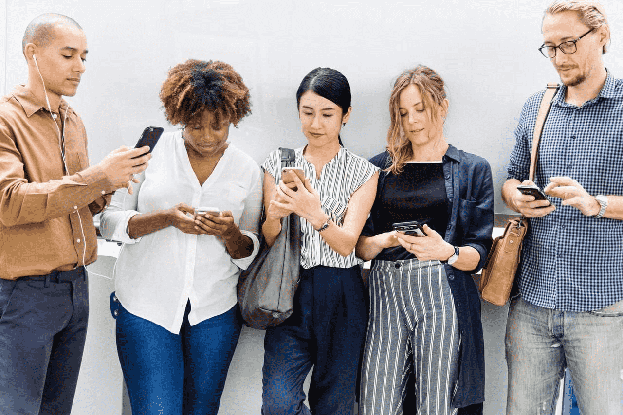 group of people staring at their phones